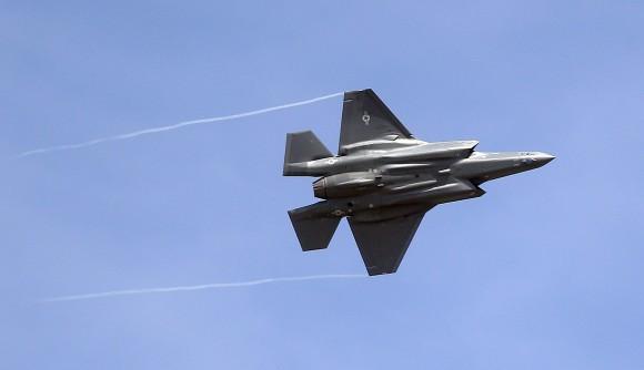 An F-35 jet arrives at its new operational base at Hill Air Force Base, in northern Utah in this Sept. 2, 2015, file photo. Shares of Lockheed Martin fell Monday, Dec. 12, 2016, as President-elect Donald Trump tweeted that making F-35 fighter planes is too costly and that he will cut "billions" in costs for military purchases. (AP Photo/Rick Bowmer)