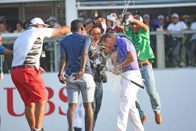 Sam Brazel gets a dousing with water after winning the UBS Hong Kong Open 2016 at Fanling on Sunday Dec 11, 2016. (Bill Cox/Epoch Times)