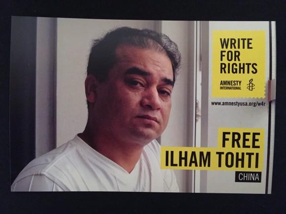 A postcard to raise awareness of prisoner of conscience Ilham Tohti in China at an Art for Amnesty event in Los Angeles, Calif. on Dec. 10. (Sarah Le/Epoch Times)