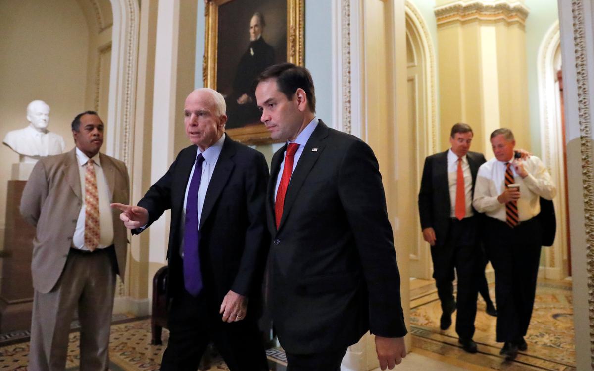 Sen. John McCain, R-Ariz. (L) and Sen. Marco Rubio, R-Fla., followed by Sen. Mark Warner, D-Va., and Sen. Richard Burr, R-N.C., walk on Capitol Hill in Washington, in this file photo. (AP Photo/Alex Brandon)