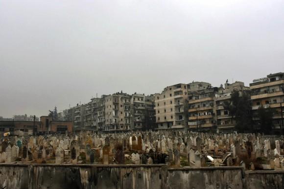 This photo, released by the Syrian official news agency SANA, shows a graveyard in east Aleppo, Syria, on Dec. 13, 2016. (SANA via AP)