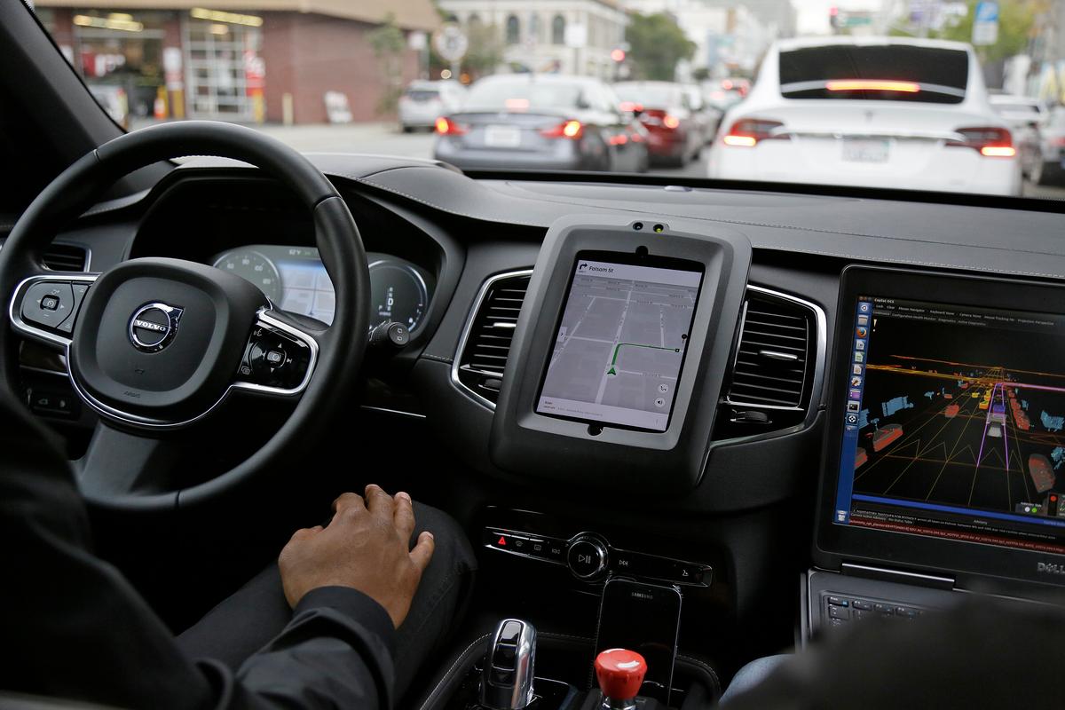 An Uber driverless car waits in traffic during a test drive in San Francisco on Dec. 13, 2016. (AP Photo/Eric Risberg)