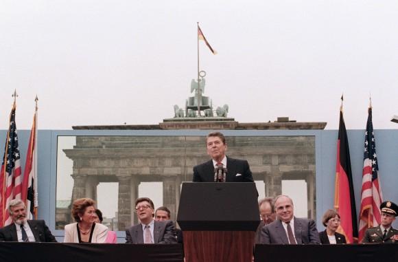 US President Ronald Reagan speaks in West Berlin at the base of the Brandenburg Gate, near the Berlin wall on Jun. 12, 1987. The President's words could also be heard on the Eastern (Communist-controlled) side of the wall, as he said, "Tear down this wall!" to Soviet leader Mikhail Gorbachev. The address Reagan delivered that day is considered by many to have affirmed the beginning of the end of the Cold War and the fall of communism. On Nov. 9-11, 1989, the people of a free Berlin tore down that wall. (MIKE SARGENT/AFP/Getty Images)