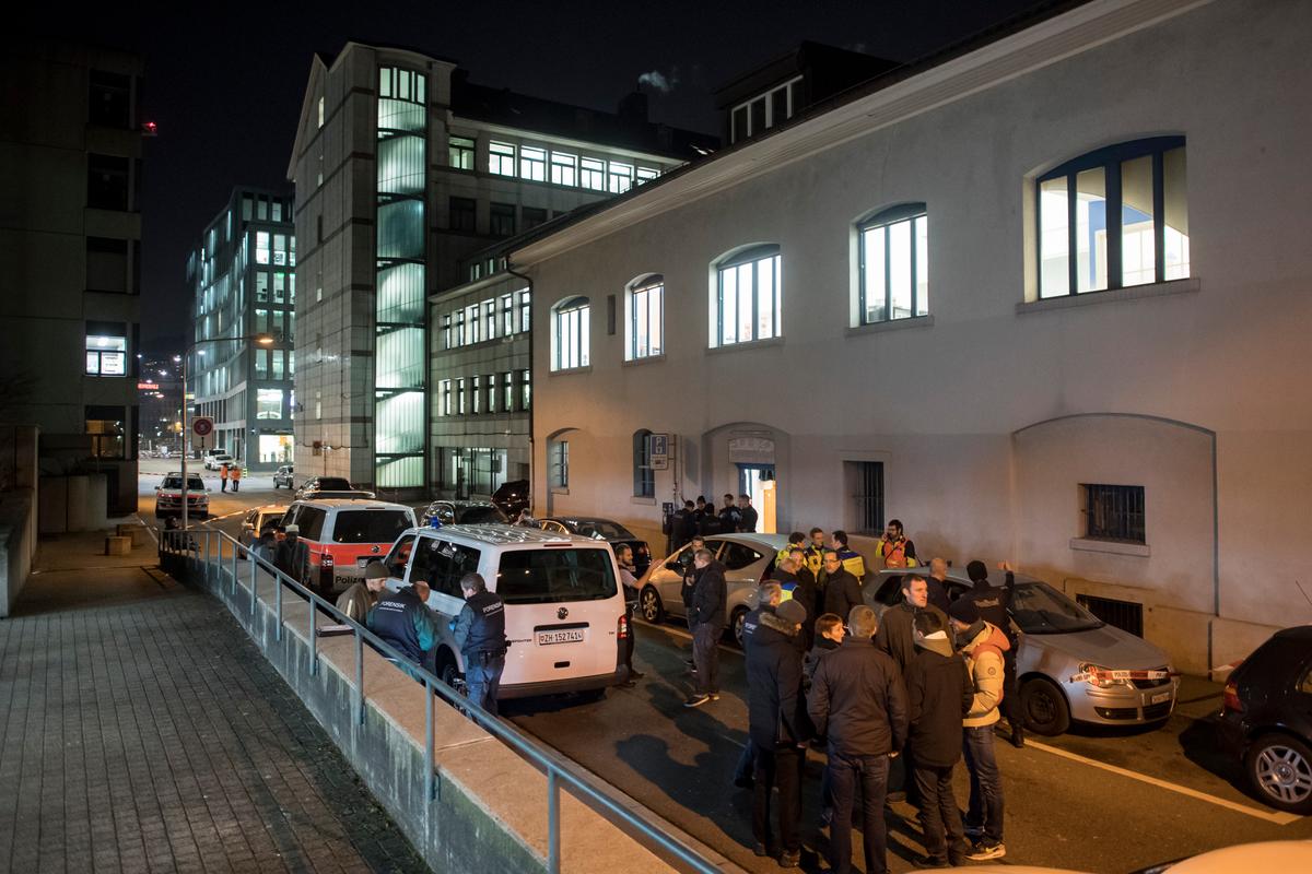 Police cars are parked in front of the Islamic center, in Zurich, on Dec. 19, 2016. (Ennio Leanza/Keystone via AP)