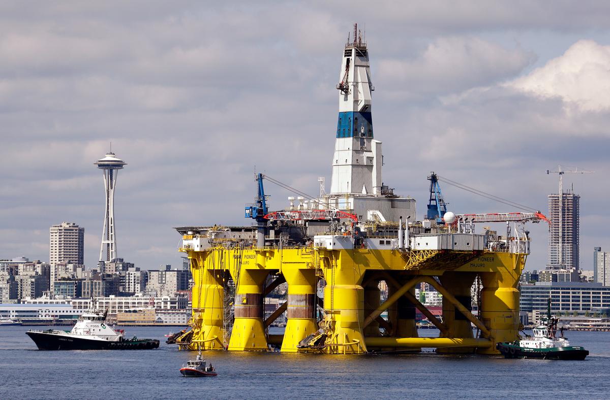 The oil drilling rig Polar Pioneer is towed toward a dock in Elliott Bay in Seattle, in this file photo. (AP Photo/Elaine Thompson, File)