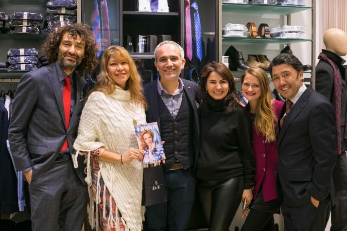 SAYKI owner Hatem Sayki (3rd from L) along with Talent in Motion magazine publisher A. Brooks, (2nd from L) and staff members of SAYKI, at the grand opening and holiday cocktail event at their first store in New York on Dec. 15, 2016. (Benjamin Chasteen/Epoch Times)