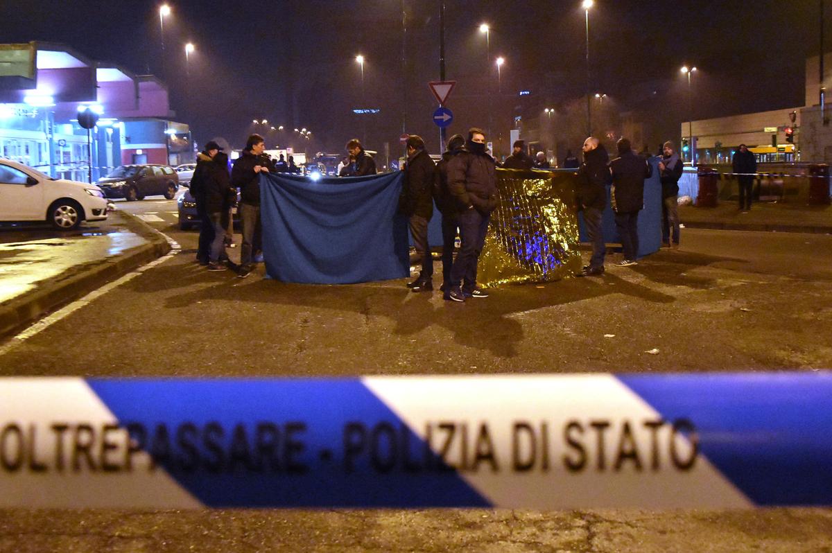 Italian Police cordon off an area after a shootout between police and a man near a train station in Milan's Sesto San Giovanni neighborhood, Italy on Dec. 23, 2016. (AP Photo/Daniele Bennati)