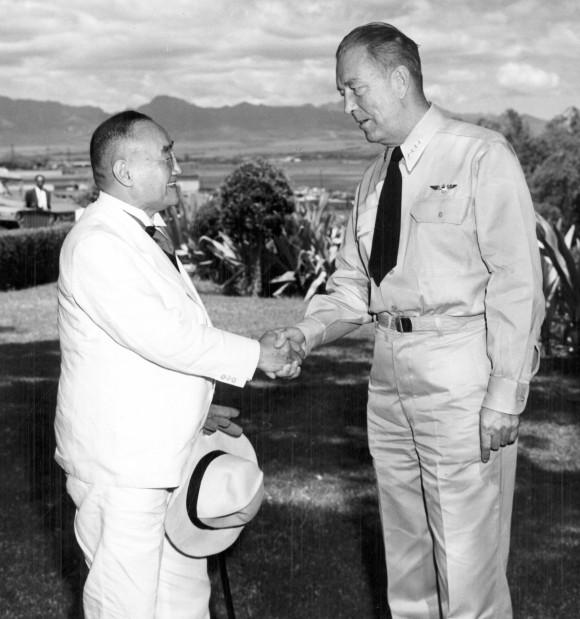 Japanese Prime Minister Shigeru Yoshida shakes hands with Adm. Arthur Radford, commander of the U.S. Pacific Fleet, at Radford's headquarters overlooking Pearl Harbor in Hawaii, on Sept. 12, 1951. (U.S. Navy via AP)