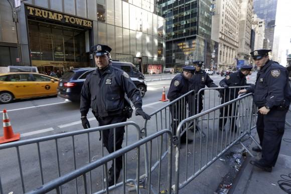 New York City Police adjust barricades across the street from Trump Tower on Fifth Avenue, in New York, Friday, Nov. 11, 2016. (AP Photo/Richard Drew)