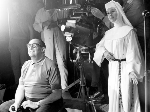 In this file photo, Debbie Reynolds, dressed as nun for her role as a singing nun in the MGM picture of that name, practices her next scene while she watches a scene being filmed. (AP Photo)