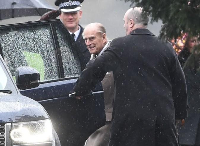 Britain's Prince Philip, centre, leaves St Mary Magdalene Church on the royal estate in Sandringham, eastern England, after attending a New Year's Day church service Sunday Jan. 1, 2017. Buckingham Palace said that Queen Elizabeth II will not be well enough to attend a New Year church service because of a lingering heavy cold. (Joe Giddens/PA via AP)
