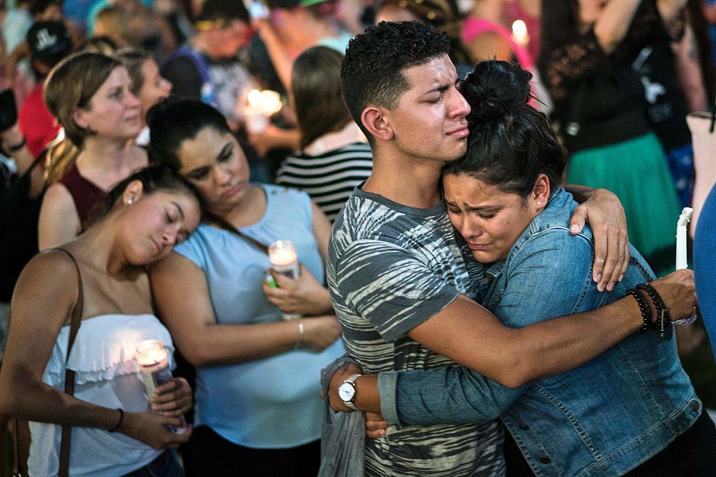 People embrace during a vigil for the mass shooting victims at the Pulse nightclub in Orlando on June 13. (BRENDAN SMIALOWSKI/AFP/Getty Images)