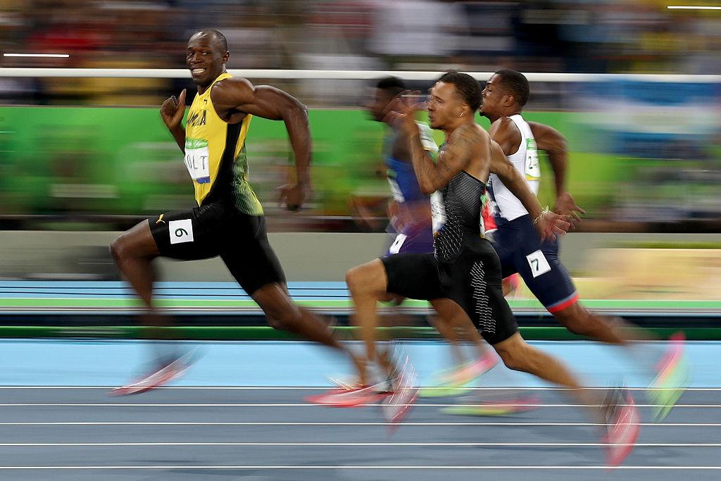 LIGHTNING STRIKES Usain Bolt of Jamaica smiles as he is about to win the men's 100-meter at the 2016 Summer Olympics in Rio on Aug. 14. (Cameron Spencer/Getty Images)