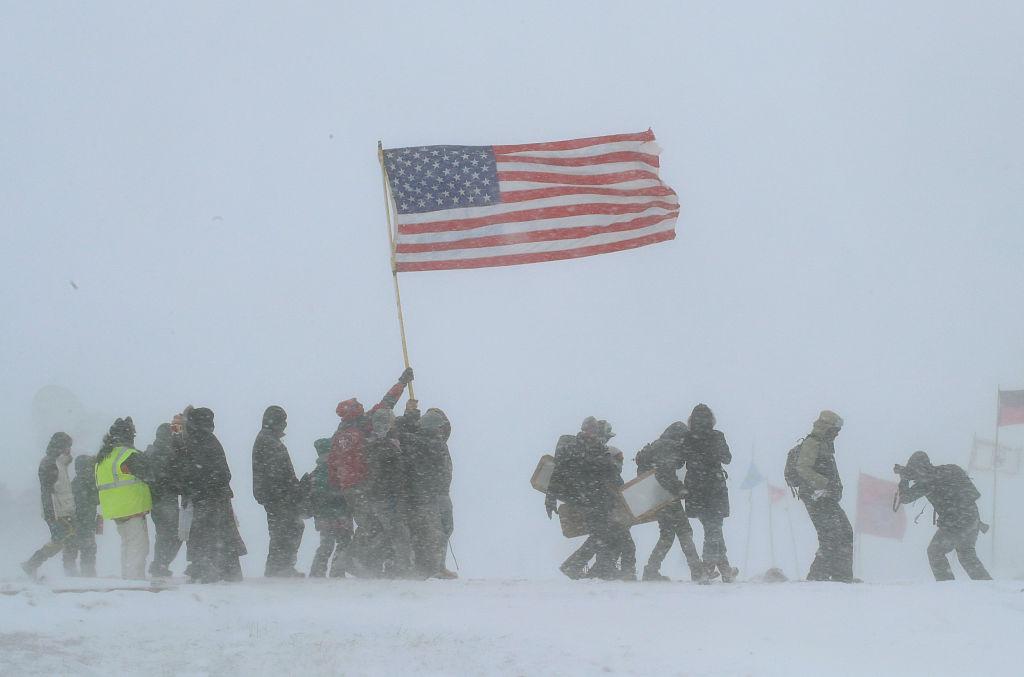 Despite blizzard conditions, military veterans march in support of the "water protectors" at Oceti Sakowin Camp on the edge of the Standing Rock Sioux Reservation on December 5 outside Cannon Ball, North Dakota. (Scott Olson/Getty Images)