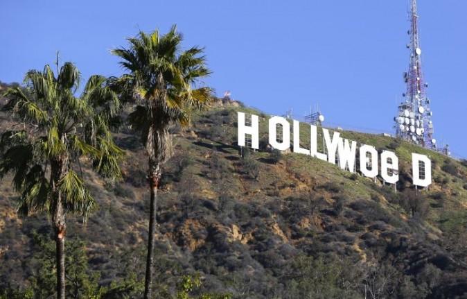 The Hollywood sign is seen vandalized Jan. 1, 2017. Los Angeles residents awoke New Year's Day to find a prankster had altered the famed Hollywood sign to read "HOLLYWeeD." (AP Photo/Damian Dovarganes)