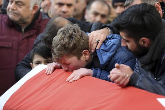 Family members and friends mourn as they attend funeral prayers for Ayhan Akin, one of the nightclub victims, in Istanbul, Jan. 1, 2017. (AP Photo)