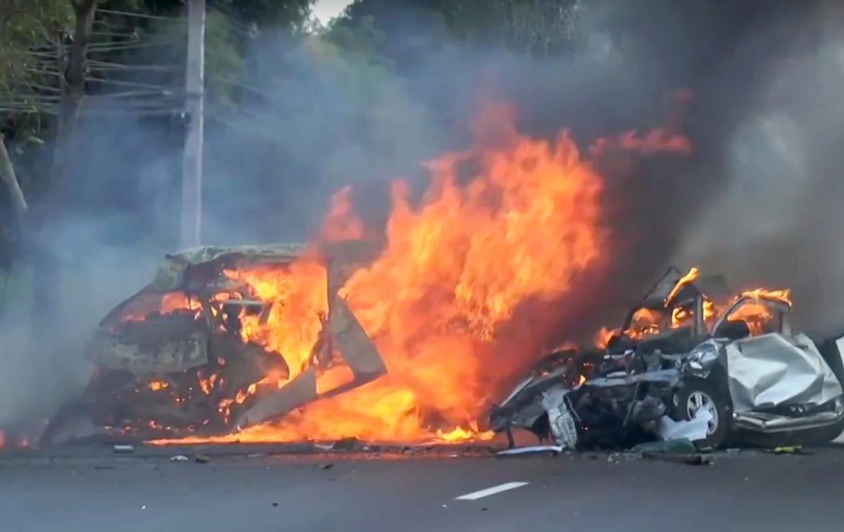 In this image made from video two vehicles burn after they collided on a highway east of Bangkok, Thailand on Jan. 2, 2017. (Matichon TV via AP)