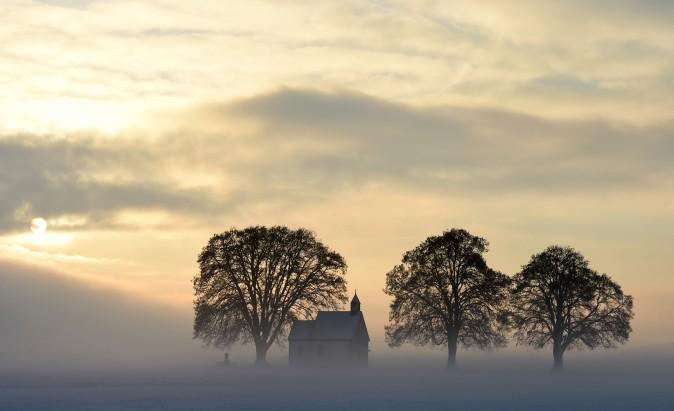 Fog surrounds a small church near the Bavarian village Apfeltrach, southern Germany, on Jan. 3, 2017. (Christof Stache/AFP/Getty Images)