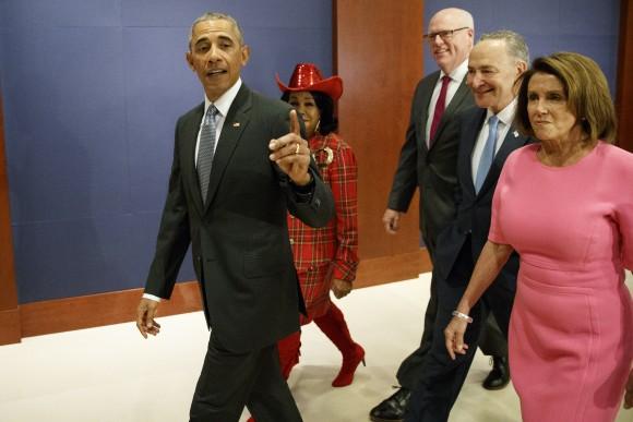 President Barack Obama, joined by, from second from left, Rep. Frederica Wilson, D-Fla., Rep. Joseph Crowley, D-N.Y., Senate Minority Leader Charles Schumer of N.Y., and House Minority Leader Nancy Pelosi of Calif. arrives on Capitol Hill in Washington on Jan. 4, 2017, to meet with members of Congress to discuss his signature healthcare law. (AP Photo/Evan Vucci)