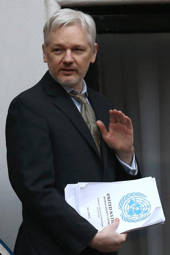 Wikileaks founder Julian Assange waves from the balcony of the Ecuadorian embassy where he continues to seek asylum following an extradition request from Sweden in 2012, in London, England on Feb. 5, 2016. (Carl Court/Getty Images)