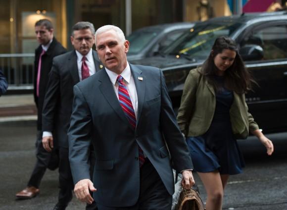 US Vice president-elect Mike Pence answers questions from reporters as he arrives at Trump Tower on Jan. 3, 2017 in New York. (DON EMMERT/AFP/Getty Images)