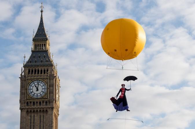 Greenpeace activists float a picture of Mary Poppins wearing a gas mask to highlight that London has breached its annual air pollution limit for 2017 in just five days in front of the Houses of Parliament in London on Jan. 6, 2017. (Chris J Ratcliffe/Getty Images)