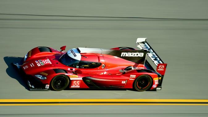 The gorgeous #55 Mazda RT24 lost time to mechanical issues but was still only 1.5 seconds off the poace of the class leader. (Bill Kent/Epoch Times)