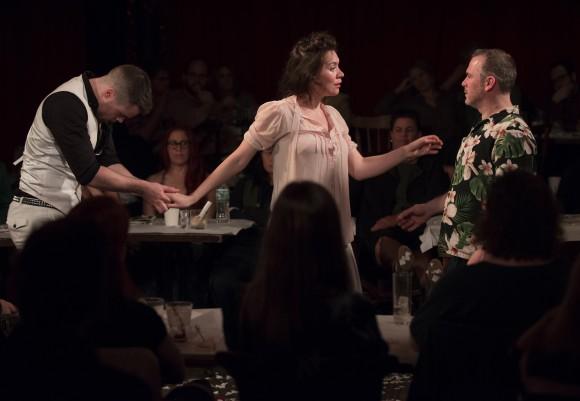 (L–R) Peter Hannah, Melody Grove, and Paul McCole in "The Strange Undoing of Prudencia Hart." The play is housed in a bar at The McKittrick Hotel. (Jenny-Anderson)