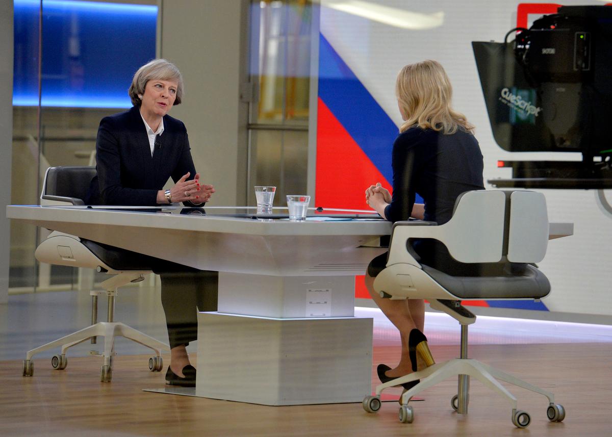 Britain's Prime Minister Theresa May, left, is interviewed by Sophy Ridge for a television channel, in London on Jan. 8, 2017. (John Stillwell/PA via AP)
