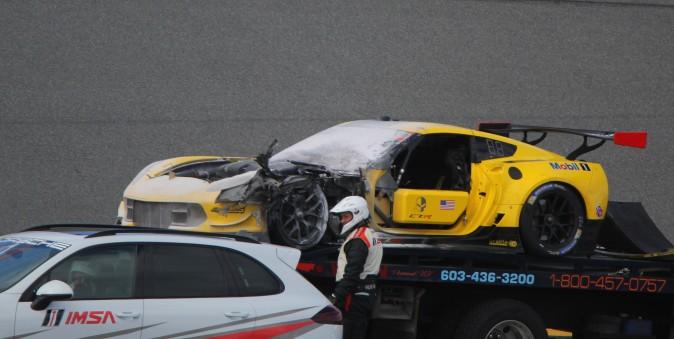 The damaged #4 Corvette Racing 7.R is hauled away after catching fire. (Chris Jasurek/Epoch Times)