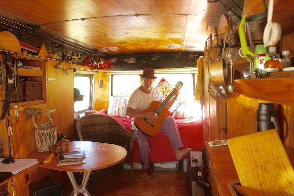 Meeting other RV'ers on the road in New Zealand: Keith Levy, storyteller and social commentator known as the Roaming Rhymester. This travelling artist lives in his large silver Bedford house bus full time. His home features beautiful and spacious wooden interiors. (Gina Nilsen/Epoch Times)