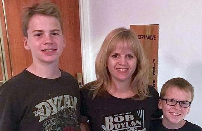 Florida school teacher Annika Dean (C) with her sons, aged 11 and 13)