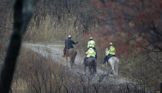 Members of the Cleveland Police Mounted Unit ride the Lake Erie shoreline, Tuesday, Jan. 3, 2017, in Cleveland. Cleveland officials say the search for a plane carrying six people that disappeared last week over Lake Erie has resumed. Tuesday marks the third straight day that conditions have allowed recovery teams to search the lake for a Columbus-bound Cessna 525 Citation that vanished from radar shortly after takeoff Thursday night from Burke Lakefront Airport. (AP Photo/Tony Dejak)