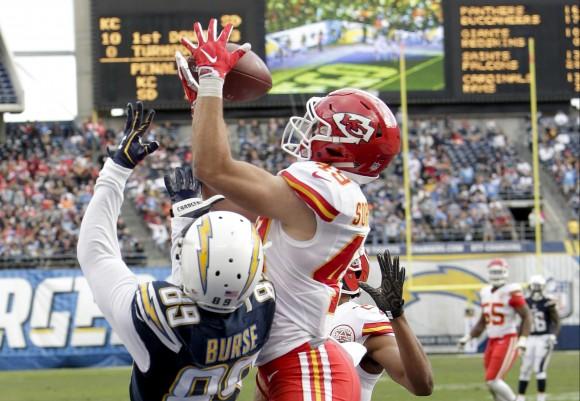 Kansas City Chiefs defensive back Daniel Sorensen (R) intercepts a pass intended for San Diego Chargers wide receiver Isaiah Burse (89) during the first half of an NFL football game in San Diego on Jan. 1, 2017. (AP Photo/Rick Scuteri)