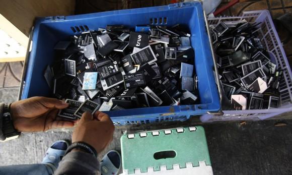 Discarded, second-hand electronics are sold on a sidewalk Bangkok, Thailand, on Jan, 12, 2017. (AP Photo/Sakchai Lalit)