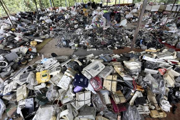 A customer browses through used items at a flea market on the outskirts of Jakarta, Indonesia, on Jan. 13, 2017. (AP Photo/Tatan Syuflana)