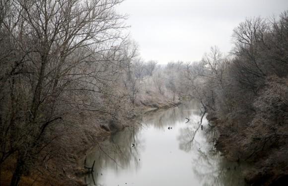 Ice hangs from trees along a creek bed in North Tulsa, on Jan. 14, 2017. (Jessie Wardarski/Tulsa World via AP)