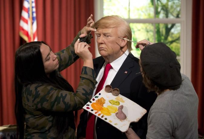 Employees put the finishing touches of a waxwork model of US President-elect Donald Trump at Madame Tussaud's in London on Jan. 18, 2017. Trump will be inaugurated Friday as the 45th president of the United States. (Isabel Infantes/AFP/Getty Images)