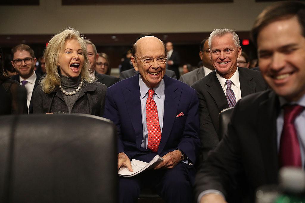 Wilbur Ross, (C) with his wife, Hilary Geary Ross, as he waits to be introduced by Sen. Marco Rubio (R-FL) (far R) to testify at his confirmation hearing in front of the Senate Commerce Committee on Capitol Hill in Washington, DC. on Jan. 18, 2017. (Joe Raedle/Getty Images)