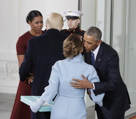 President Barack Obama greets Melania Trump as first lady Michelle Obama greets President-elect Donald Trump at the White House in Washington on Jan. 20, 2017. (AP Photo/Evan Vucci)