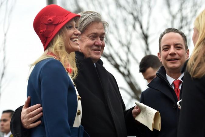 (L-R) Kellyanne Conway, Steve Bannon and Reince Priebus speak outside St. John's Episcopal Church before the inauguration of US President-elect Donald Trump on Jan. 20, 2017. (NICHOLAS KAMM/AFP/Getty Images)