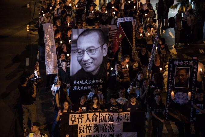 People attend a candlelight march for the late Chinese Nobel laureate Liu Xiaobo in Hong Kong on July 15, 2017. Liu died on July 13 after a battle with cancer, remaining in custody until the end, making him the first Nobel Peace Prize laureate to die in state custody since German pacifist Carl von Ossietzky in 1938. (DALE DE LA REY/AFP/Getty Images)