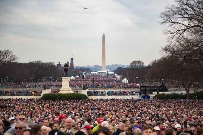 Spectators fill the National Mall in front of the U.S. Capitol during the inauguration of Donald Trump as the 45th President in Washington, on Jan. 20, 2017.(Benjamin Chasteen/Epoch Times)