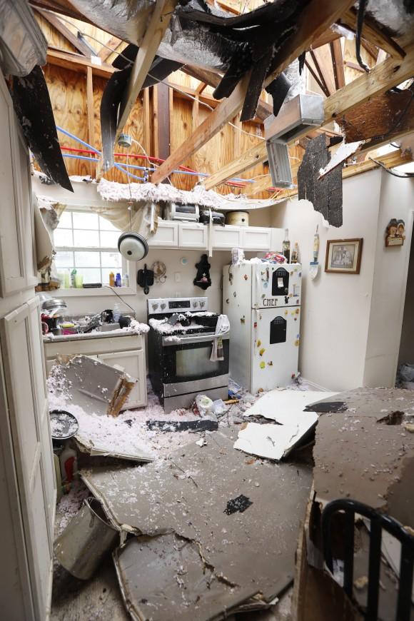 An open kitchen littered with roofing and ceiling debris show the strength of the tornado that hit this south Mississippi community in Hattiesburg, Miss., on Jan. 21, 2017. (AP Photo/Rogelio V. Solis)