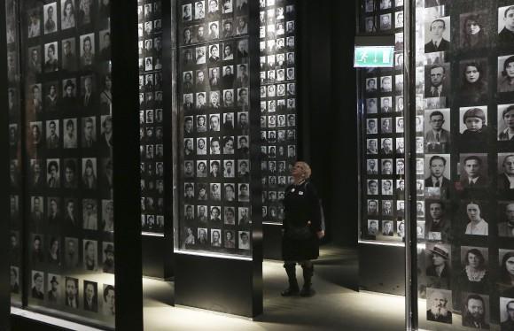 A visitor looks at an exhibit in the Museum of the Second World War, an ambitious new museum under creation for nine years has opened its doors for a day to historians, museums and reporters in Gdansk, Poland, on Jan. 23, 2017. (AP Photo/Czarek Sokolowski)