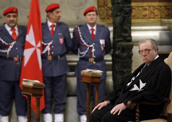 Grand Master of the Knights of Malta Matthew Festing waits for the start of a Mass celebrated by Cardinal Tacisio Bertone, not pictured, to mark the 900th anniversary of the Order of the Knights of Malta, at the Vatican in this Feb. 9, 2013 file photo. (AP Photo/Gregorio Borgia, File)