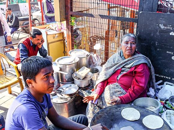 Veena Madan (R), a street vendor, on Jan. 16, says she has been forced to provide meals on credit to customers because of the cash shortage. (Epoch Times Contributor)