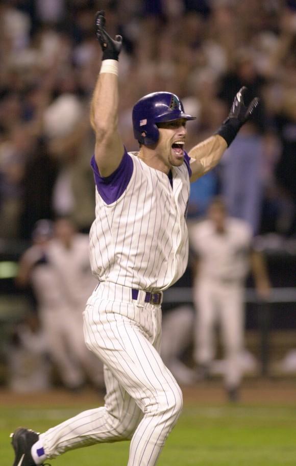 Arizona Diamondbacks' Luis Gonzalez celebrates driving in the winning run in the ninth inning of Game 7 of the baseball World Series against the New York Yankees in Phoenix on Nov. 4, 2001. Less than two months after the terrorist attacks knocked down the World Trade Center towers, the New York Yankees had the country behind them for once during the 2001 World Series as emotional renditions of "God Bless America" stirred fans and players alike. (AP Photo/John Bazemore, File)