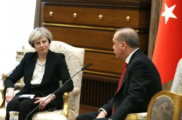 Turkey's President Recep Tayyip Erdogan, right, talks with British Prime Minister Theresa May, during their meeting at the Presidential Palace in Ankara, Turkey, Saturday, Jan. 28, 2017. (Presidential Press Service, Pool via AP)