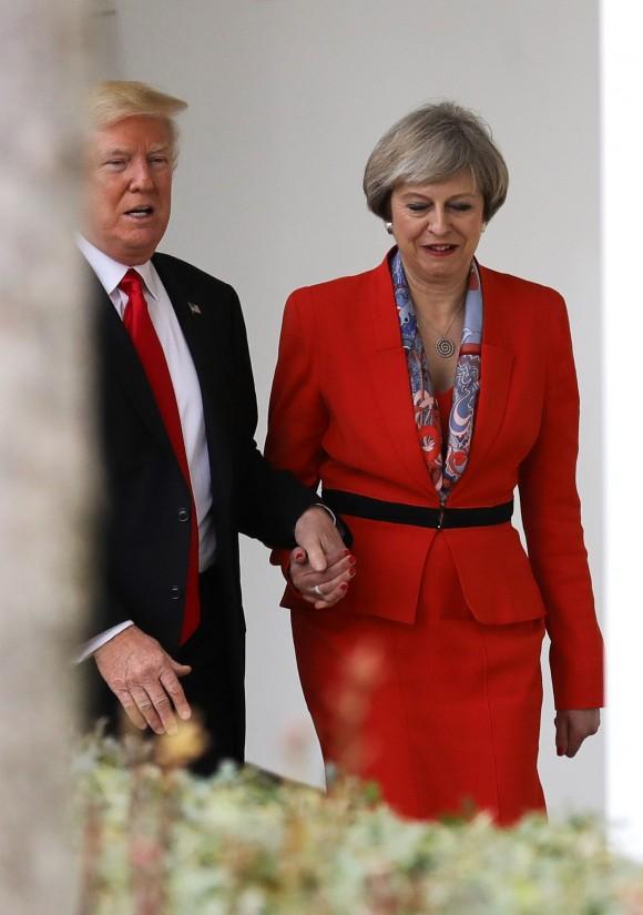 British Prime Minister Theresa May with U.S. President Donald Trump walk along The Colonnade at The White House in Washington, DC, on Jan. 27, 2017. (Christopher Furlong/Getty Images)